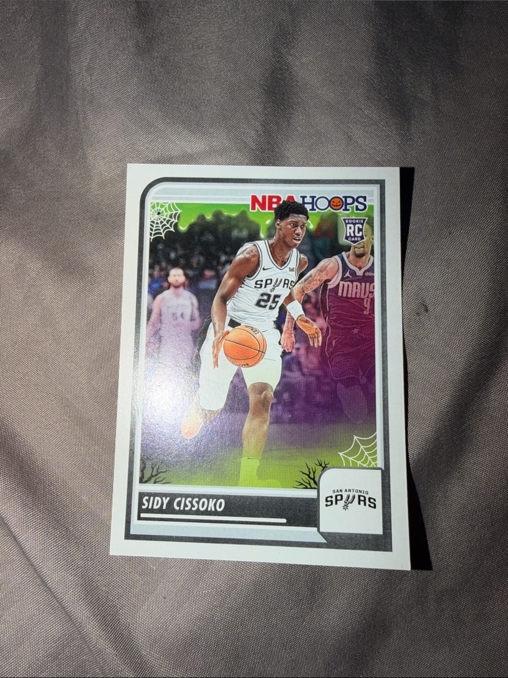 2023-24 Sidy Cissoko Panini Haunted Hoops Slime Parallel Rookie Card #143